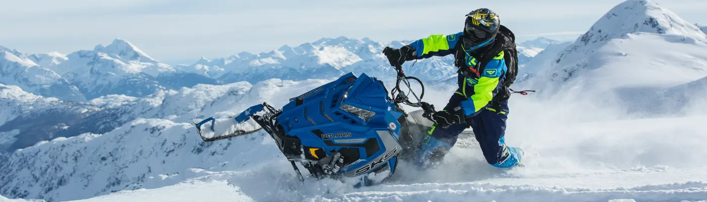 A man on a snowmobile.